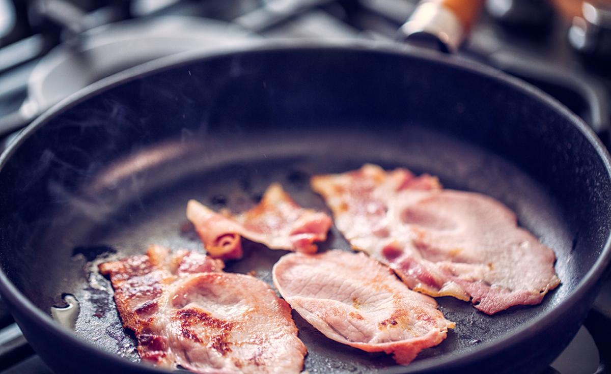 Rashers of bacon in a frying pan